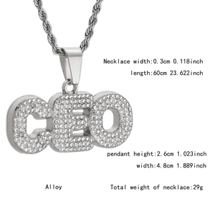 Detailed macro view of iced out CEO letters pendant with shiny pave crystals