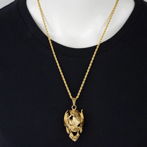 Pendentif masque de crâne hip hop doré sur chaîne torsadée pour homme en acier titane