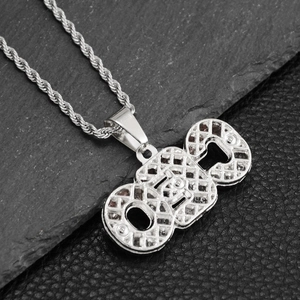 Detail view of silver hiphop pendant with unique honeycomb mesh and classic rope chain