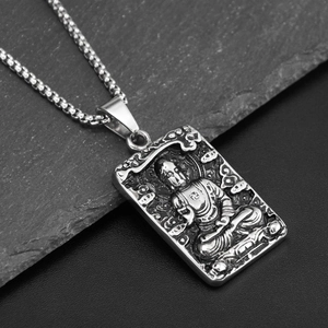 Hip hop style stainless steel necklace featuring a vintage Buddha relief pendant on a rock background