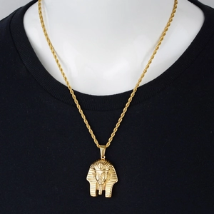 Hip hop style gold Egyptian Pharaoh mask pendant necklace with twisted rope chain on black shirt