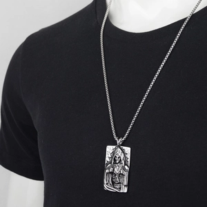 Gothic skull reaper pendant necklace in vintage steel finish worn on black t-shirt