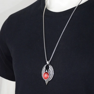Gothic eagle wing pendant with red demon eye on a silver box chain necklace