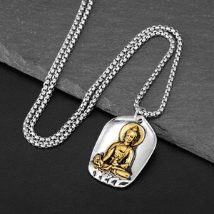 Hip hop Buddha pendant necklace in silver and gold titanium steel on stone background