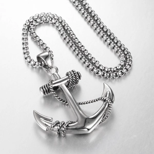 Macro shot of silver anchor pendant with rope detail and polished stainless steel box chain