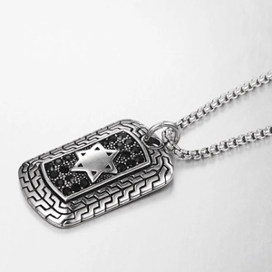 Macro shot of hip hop hexagon star pendant necklace with black crystals and box chain