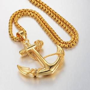 Polished gold anchor pendant necklace with rope detail on a textured box chain for men