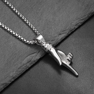 Detailed view of hip hop style finger gesture pendant with a silver square round chain