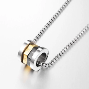 Macro shot of stainless steel cylinder pendant with engraved Roman numerals on box chain