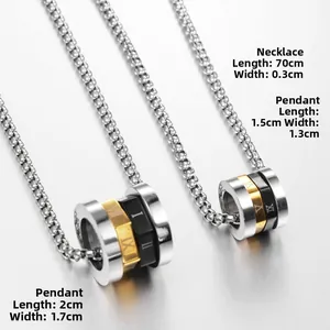 Macro view of stainless steel cylinder pendant with Roman numerals in gold and black finish