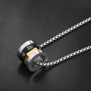 Detail of three-tone cylindrical pendant with Roman numerals on a steel box chain