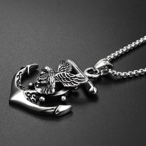 Macro shot of hip-hop eagle and anchor titanium steel pendant with metallic texture