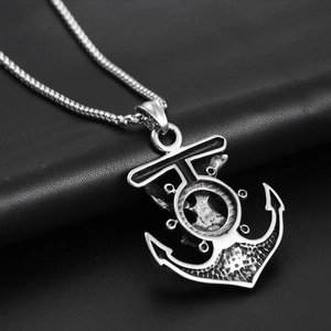 Macro shot of vintage titanium steel anchor pendant with nautical details on black leather