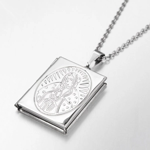Polished silver book locket necklace with Our Lady of Guadalupe engraving and cross chain