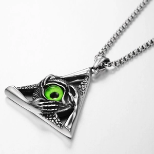 Macro detail of gothic triangle evil eye pendant with claw design on a steel box chain