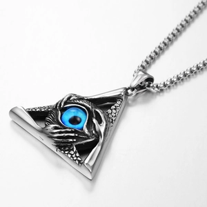 Macro view of triangle evil eye pendant in silver finish with blue glass eyeball