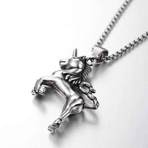 Macro shot of silver unicorn pendant with intricate carving on a sturdy ball chain