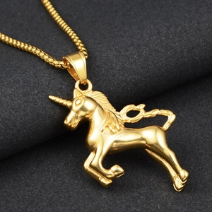 Detailed close-up of a golden unicorn pendant on a premium box chain necklace