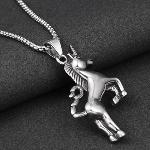 Macro shot of silver unicorn pendant featuring detailed mane texture on box chain