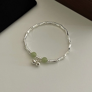 Elegant silver bamboo joint bracelet with green beads and bells in Chinese style