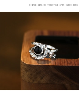 Macro shot of silver textured lava ring with black onyx stone and zircon accents