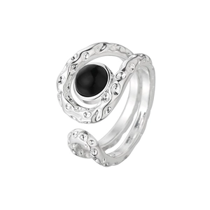Silver open ring with irregular lava texture and a central round black onyx stone