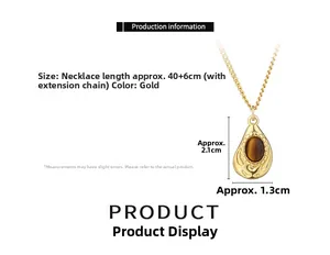 Detail view of teardrop tiger eye pendant with 40+6cm gold chain dimensions