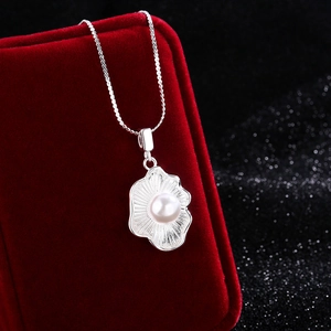 Elegant shell pearl pendant necklace with S925 silver chain over a red jewelry box