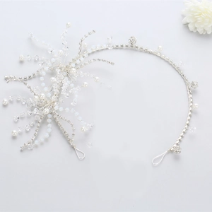 Elegant bridal silver hairband with sparkling crystals and white pearls for wedding dress