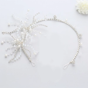 Silver bridal headband featuring sparkling crystals and pearls in a starburst design