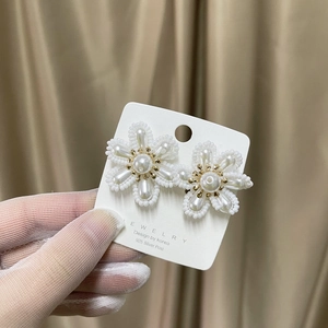 Handmade bridal flower earrings with white pearls and 925 silver posts in gold finish