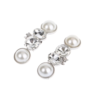 Elegant silver shoe buckles with large pearls and sparkling rhinestones for bridal shoes