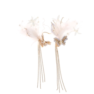 Pink feather butterfly hair clips with long tassels and pearls for bridal styling