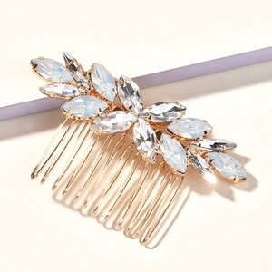 Elegant gold bridal hair comb with opal rhinestones in a leaf design for wedding styles