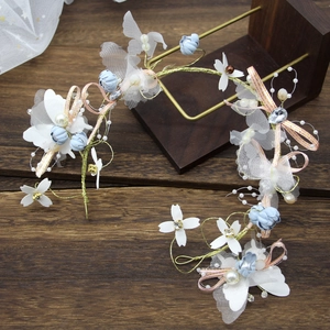 Floral bridal crown with blue fabric flowers, pearls, and rhinestones on gold wire