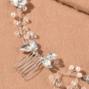 Handmade silver bridal hair comb with elegant metallic leaves pearls and crystals