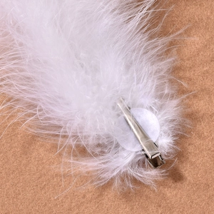White feather bridal hair clip with silver duckbill attachment for weddings and parties