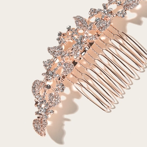 Elegant rose gold bridal hair comb with sparkling rhinestones and floral leaf design