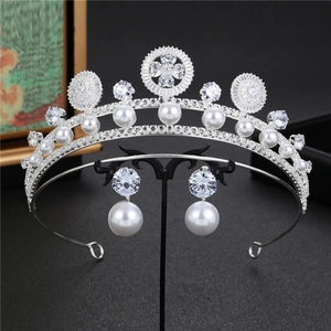 Baroque pearl bridal tiara and earrings set with silver zircon inlays on black background