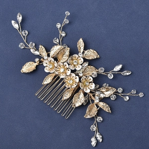 Golden bridal hair comb with white flowers, marquise crystals and leaves for weddings