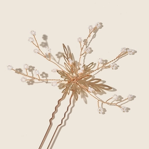Golden bridal hair pin with handcrafted pearl flowers and leaf design for weddings