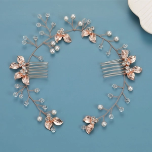 Elegant gold bridal hair comb with pearls and rhinestones on a blue background