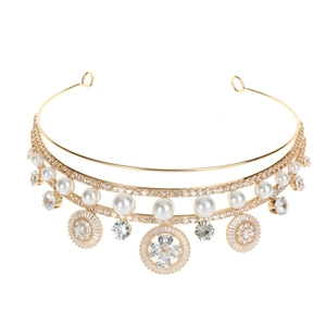 Close-up of luxury gold bridal crown featuring white pearls and marquise zircon stones
