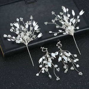 Elegant bridal hair pins and white pearl clip-on earrings set with crystal beads
