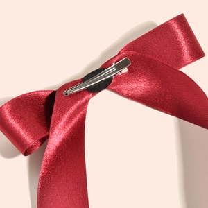 Elegant red double-sided satin bow hair clip with silver metal alligator grip for weddings