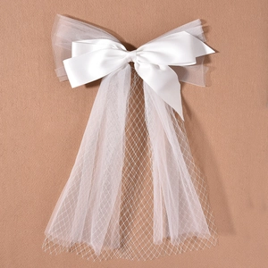 Elegant white satin bow hair clip with organza mesh veil for bridal wedding hair accessories