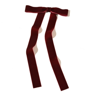 Detailed view of dark burgundy velvet long bow hair clip with elegant fabric texture