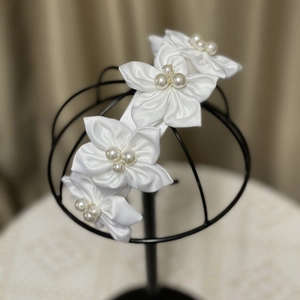 Elegant white camellia headband with satin flowers and pearls for bridal wedding styling