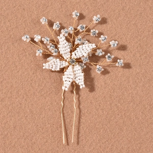 Handmade bridal hair pin with white beaded flowers and rhinestones on a gold U-shaped pin