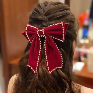 Elegant large red velvet bow hair clip with sparkling rhinestones for bridal hairstyle